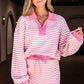 Woman wearing a pink and white striped outfit with sunglasses indoors.